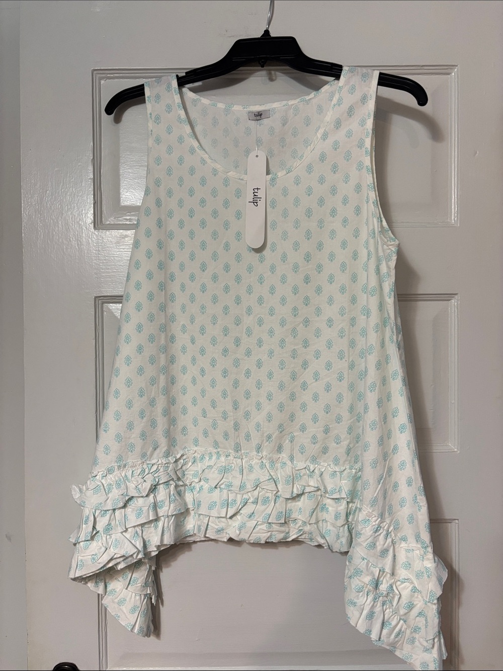 Sleeveless White Tank with Aqua Leaf Print and Ruffle Hem